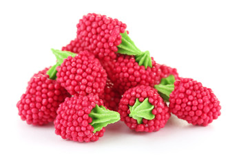 red candy raspberries isolated on white