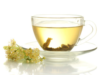 cup of linden tea and flowers isolated on white
