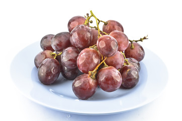 red grape fruits on dish