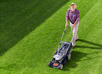 mowing senior man