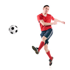 Obraz na płótnie Canvas soccer player hits the ball