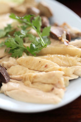 Thai food gourmet steamed chicken  , khao mun kai in wood backgr