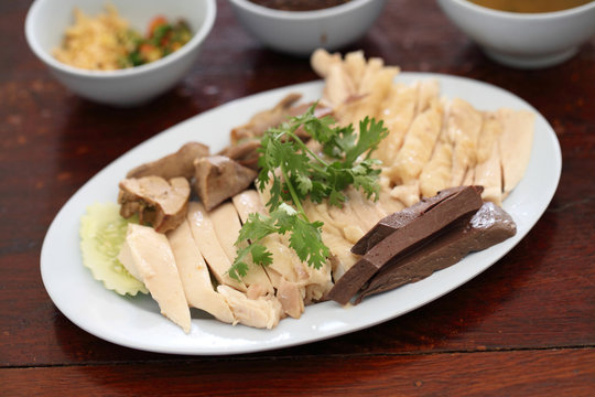 Thai food gourmet steamed chicken  , khao mun kai in wood backgr