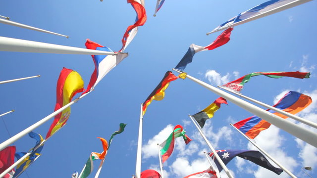 Flags of the countries of World on a background of blue sky