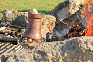 Coffee pot on a fire