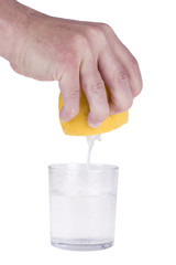 Squeezing lemon on white bacground