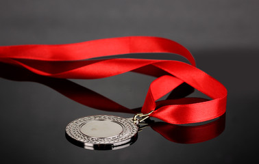 Silver medal on grey background
