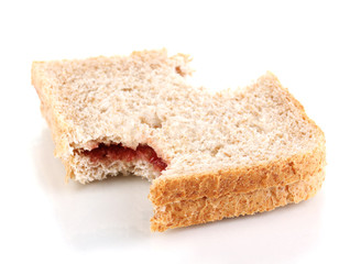 Bitten sandwich with jam isolated on white