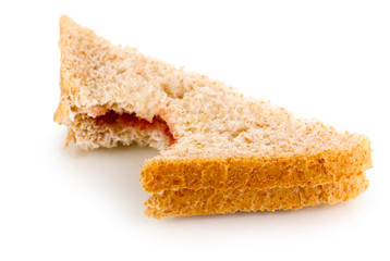 Bitten sandwich with jam isolated on white