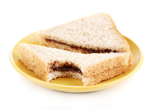 Bitten sandwiches with chocolate on plate isolated on white