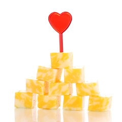 Cheese pyramid isolated on white