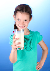 Portrait of beautiful little girl withglass of milk
