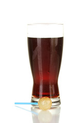 Lollipop with a taste of cola with a glass of cola isolated