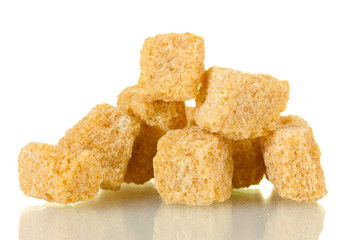 brown cane sugar cubes isolated on white