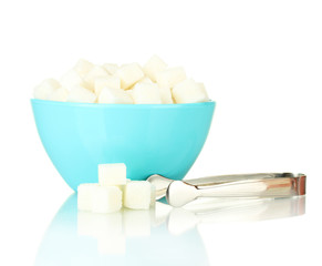 White lump sugar in bowl with sugar-tongs isolated on white
