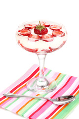 Glass of ripe strawberries with cream isolated on white