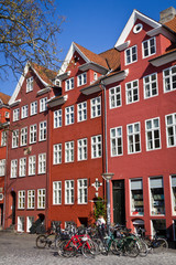 Obraz premium Bicycles standing next to a traditional gabled house