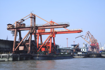Fototapeta na wymiar Port cranes and container trade
