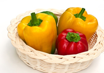 fresh sweet  paprika in wood basket.