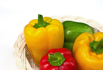 fresh sweet  paprika in wood basket.