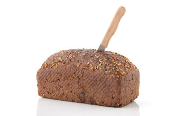 Healthy brown bread with knife
