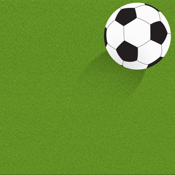Football soccer on grass background