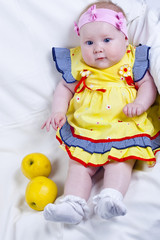 Beautiful little girl and apples
