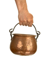 Hand holding bronze pot