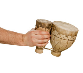 Hand holding tom-tom drums