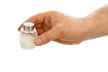 Hand holds salt cellar