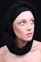 Beautiful young woman with black scarf