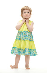 Cute barefooted baby girl in summer dress