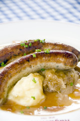 Grobe sausage bratwurst with mashed potatos sauerkraut
