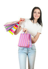 beautiful young girl holding bright bags isolated on white