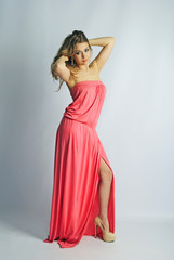 Fototapeta premium beautiful girl in rose long year peasant woman's dress