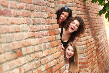 three beautiful women smiling