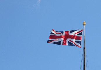 Flag of the United Kingdom on blue sky