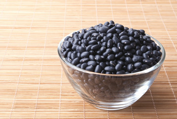 glass bowl full of black small beans