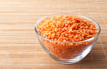 glass bowl full of red split lentils