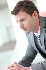 Portrait of businessman waiting in hall