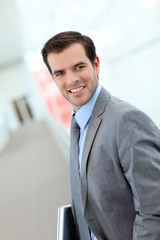 Fototapeta premium Portrait of businessman standing in hall