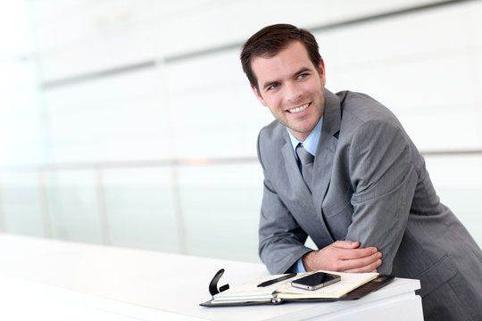 Businessman looking at appointments on agenda