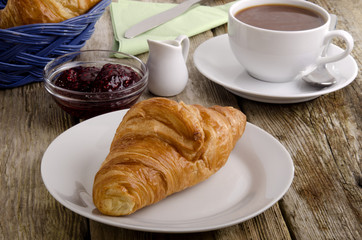 croissant, a French breakfast on a plate