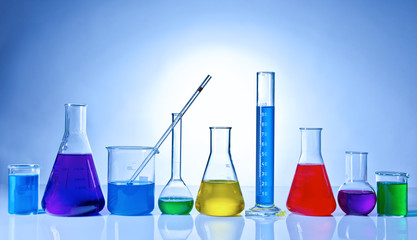 Chemical glasswares with colored liquids inside bottles