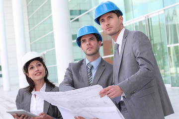 Business people checking construction site
