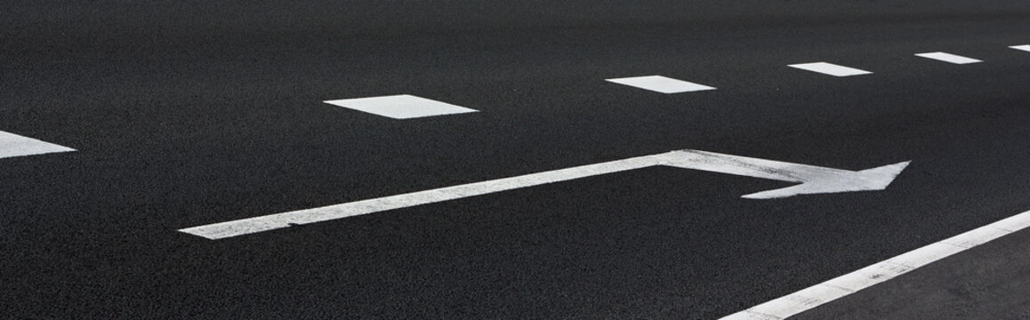 White arrow on the asphalt