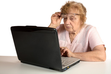 Granny with the laptop isolated on a white