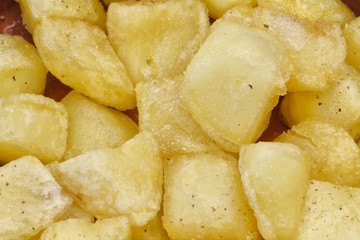 Fried pieces of potatoes
