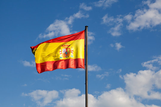 Spanish Flag in a Blue Sky