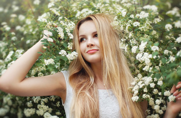 The beautiful blonde in a short white dress